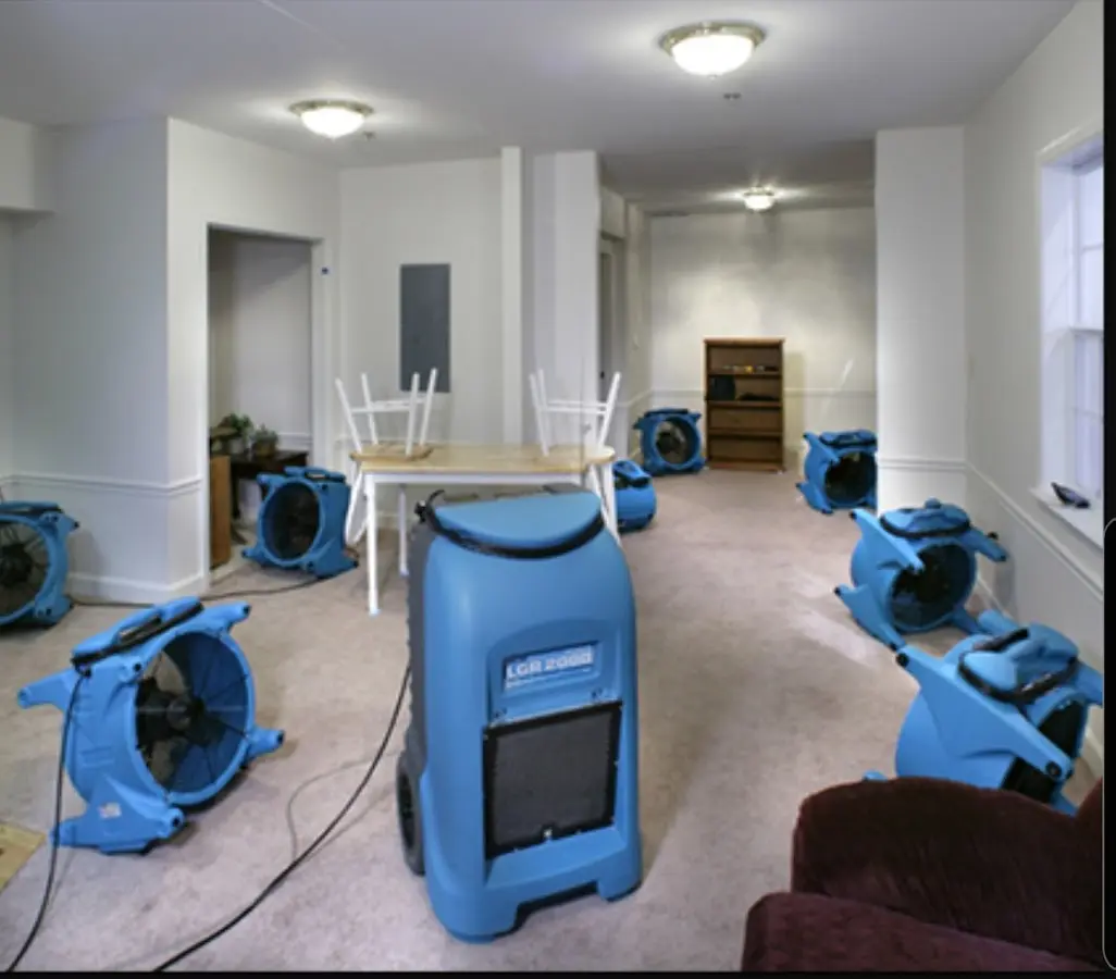 Air movers and dehumidifier setup for Water Damage Restoration in Elkins